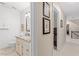 Elegant bathroom featuring a granite countertop, vanity, toilet, and framed artwork at 8508 Zinfandel Pl, Raleigh, NC 27615