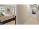 Bedroom with windows overlooking the backyard, carpeted floors, and an ensuite bath at 8508 Zinfandel Pl, Raleigh, NC 27615