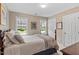 Bedroom with multiple windows, closet access and a double bed frame at 8508 Zinfandel Pl, Raleigh, NC 27615
