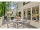 Outdoor deck featuring an outdoor seating area and large windows into the house at 8508 Zinfandel Pl, Raleigh, NC 27615