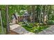 Charming two-story brick home featuring a two-car garage, dormer windows, and professionally landscaped front yard at 8508 Zinfandel Pl, Raleigh, NC 27615
