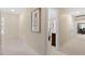 Hallway with neutral walls and carpet, leading to a bedroom and other rooms at 8508 Zinfandel Pl, Raleigh, NC 27615