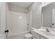 Bathroom area featuring a shower-tub combo with an overhead shower-head, and a single sink at 8912 Erinsbrook Dr, Raleigh, NC 27617
