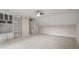 This is a spacious bonus room with wall-to-wall carpeting and custom built-in shelving at 8912 Erinsbrook Dr, Raleigh, NC 27617