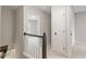 Upstairs hallway featuring an open doorway and two entry ways to other rooms in the house at 8912 Erinsbrook Dr, Raleigh, NC 27617