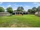 Expansive backyard featuring a large deck, a greenhouse and a privacy fence at 914 Forest Dr, Garner, NC 27529