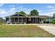 Charming single-story home boasts a screened porch, carport, and manicured landscaping at 914 Forest Dr, Garner, NC 27529