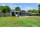 Beautiful house exterior with a screened in porch, side yard, and a well maintained lawn at 914 Forest Dr, Garner, NC 27529