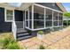 Close-up of front porch showing stepping stones, landscaping, and screened-in porch entrance at 914 Forest Dr, Garner, NC 27529