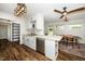 Bright kitchen with white cabinets, stainless steel appliances, peninsula, and dining area with natural light at 914 Forest Dr, Garner, NC 27529