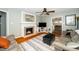 Cozy living room features fireplace, hardwood floors, and stylish decor at 914 Forest Dr, Garner, NC 27529