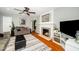 Inviting living room features a fireplace, plush sofa, and stylish decor, creating a cozy atmosphere at 914 Forest Dr, Garner, NC 27529