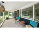 Comfortable screened porch with seating, rug, and view of the front yard at 914 Forest Dr, Garner, NC 27529