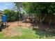 Fenced backyard area featuring a chicken coop and plenty of space for outdoor activities at 914 Forest Dr, Garner, NC 27529