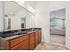 Bathroom showcasing a vanity with dual sinks connecting to the bedroom at 9530 Vira Dr, Raleigh, NC 27617