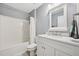 Bright bathroom featuring a shower-tub combo and white vanity at 9530 Vira Dr, Raleigh, NC 27617