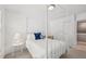 Bright bedroom featuring a four poster bed, large windows and light-colored walls at 9530 Vira Dr, Raleigh, NC 27617