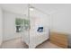 Bright bedroom featuring a four poster bed, large windows and light-colored walls at 9530 Vira Dr, Raleigh, NC 27617