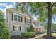 Charming two-story home featuring red shutters, well-maintained landscaping, and a lush green tree at 9530 Vira Dr, Raleigh, NC 27617