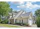 Beautiful home with a well-maintained lawn, brick accents, and an attached two-car garage at 9530 Vira Dr, Raleigh, NC 27617