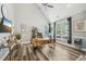 Home office with a large wooden desk, ceiling fan, and a window providing natural light at 9530 Vira Dr, Raleigh, NC 27617