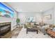 Comfortable living room featuring a fireplace, plush sofa, and stylish decor at 9530 Vira Dr, Raleigh, NC 27617