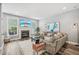 Cozy living room with a fireplace, large sectional sofa, and a mounted television at 9530 Vira Dr, Raleigh, NC 27617