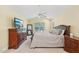 Bright primary bedroom featuring a flat screen TV and neutral colored walls at 9530 Vira Dr, Raleigh, NC 27617