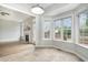Bright breakfast nook with lots of windows and views to the backyard at 9612 Treymore Dr, Raleigh, NC 27617