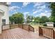 Spacious wooden deck overlooking a well-maintained backyard with lush greenery and privacy fence at 9612 Treymore Dr, Raleigh, NC 27617