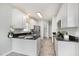 Spacious kitchen with island, black countertops, stainless steel appliances, and ample cabinet space at 9612 Treymore Dr, Raleigh, NC 27617