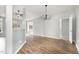 Bright and open living space with hardwood floors and a view into the kitchen at 9612 Treymore Dr, Raleigh, NC 27617
