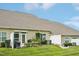 Exterior backyard view featuring a lush lawn, patio area, and surrounding greenery at 1004 Lake Michael Way, Mebane, NC 27302