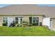 Backyard with a green lawn and patio area featuring a grill and gardening space at 1004 Lake Michael Way, Mebane, NC 27302