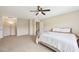 Bright bedroom boasts plush carpeting, ceiling fan, and comfortable bedding for a cozy retreat at 1004 Lake Michael Way, Mebane, NC 27302