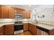 Modern kitchen with granite countertops, stainless steel appliances, and ample cabinet space at 1004 Lake Michael Way, Mebane, NC 27302