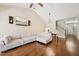 Open-concept living space featuring hardwood floors, a vaulted ceiling, and seamless flow into the dining area at 1004 Lake Michael Way, Mebane, NC 27302