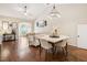 Spacious living and dining area with hardwood floors, vaulted ceilings, and an open layout perfect for entertaining at 1004 Lake Michael Way, Mebane, NC 27302