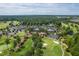 Aerial view showcasing the beautiful community with lush greenery and golf course views at 101 Deerwalk Ct, Cary, NC 27513