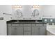 Bathroom vanity with double sinks, granite countertop, and decorative light fixtures at 101 Deerwalk Ct, Cary, NC 27513