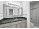 Bathroom vanity with granite countertop, mirrored sink, and shower with glass door at 101 Deerwalk Ct, Cary, NC 27513