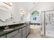 Bathroom features a soaking tub, separate glass enclosed shower, and dual vanities at 101 Deerwalk Ct, Cary, NC 27513