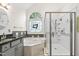 Well lit bathroom features a tub, glass enclosed shower, and stylish finishes at 101 Deerwalk Ct, Cary, NC 27513