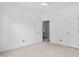 Neutral bedroom featuring a double door closet and an entrance at 101 Deerwalk Ct, Cary, NC 27513