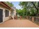 Expansive wooden deck features modern railing, perfect for outdoor entertaining and relaxation at 101 Deerwalk Ct, Cary, NC 27513