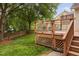 A wooden deck offers an outdoor space to enjoy the manicured backyard and landscaping at 101 Deerwalk Ct, Cary, NC 27513
