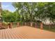 Large wooden deck with a modern railing providing a great space for outdoor relaxation and social gatherings at 101 Deerwalk Ct, Cary, NC 27513