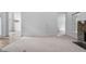 Expansive living room showcasing hardwood floors, recessed lighting, and an archway leading to another room at 101 Deerwalk Ct, Cary, NC 27513