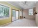 Bright sunroom with large windows and sliding door leading to an outdoor deck at 101 Deerwalk Ct, Cary, NC 27513