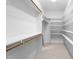 Walk-in closet with built-in shelving and racks for optimal organization at 101 Deerwalk Ct, Cary, NC 27513